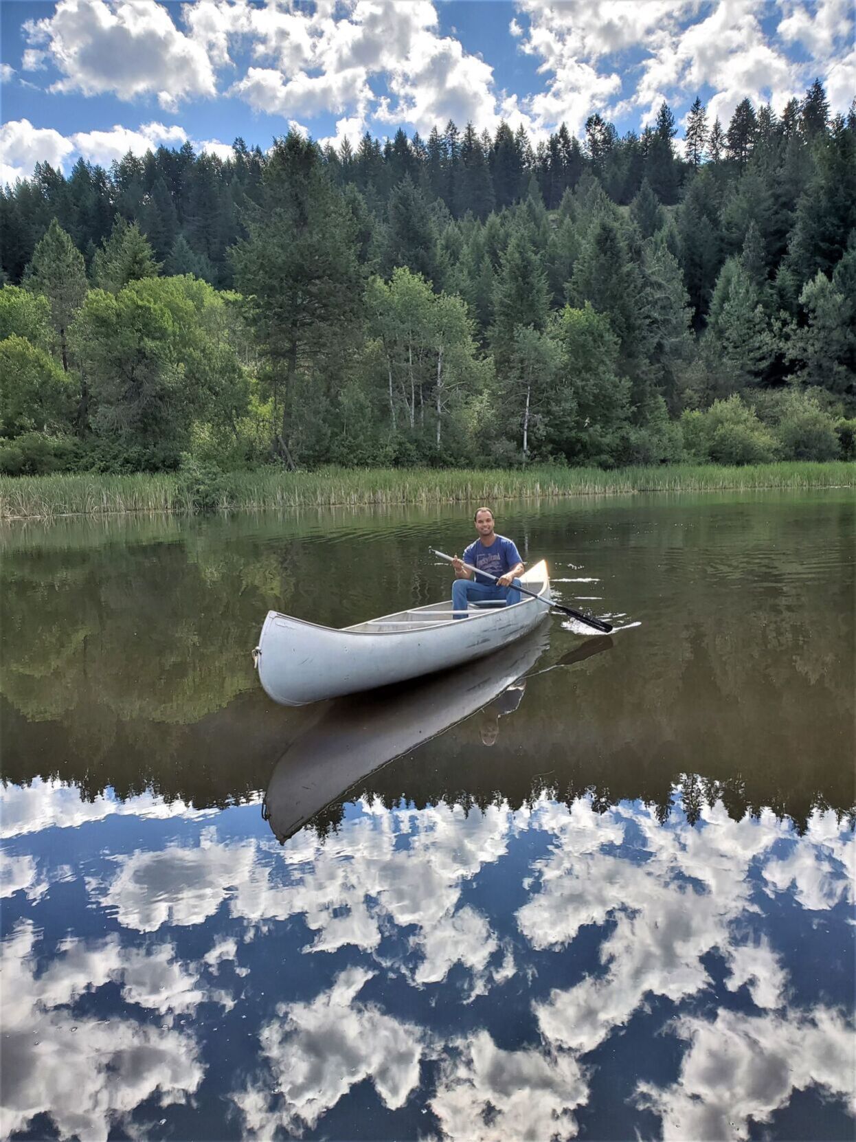 Canoe between clouds